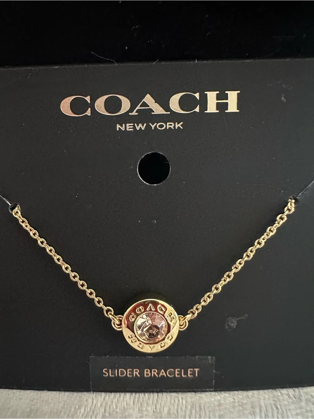 Coach Gold-Tone Bracelet with Light Pink Crystal - Picture 1 of 2
